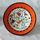 Bols oranges faits main, vue du motif