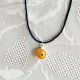 Pendentif oeil Turc orange 1 cm avec cordon noir