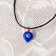 Pendentif oeil Turc forme goutte d'eau 1 cm avec perle rouge
